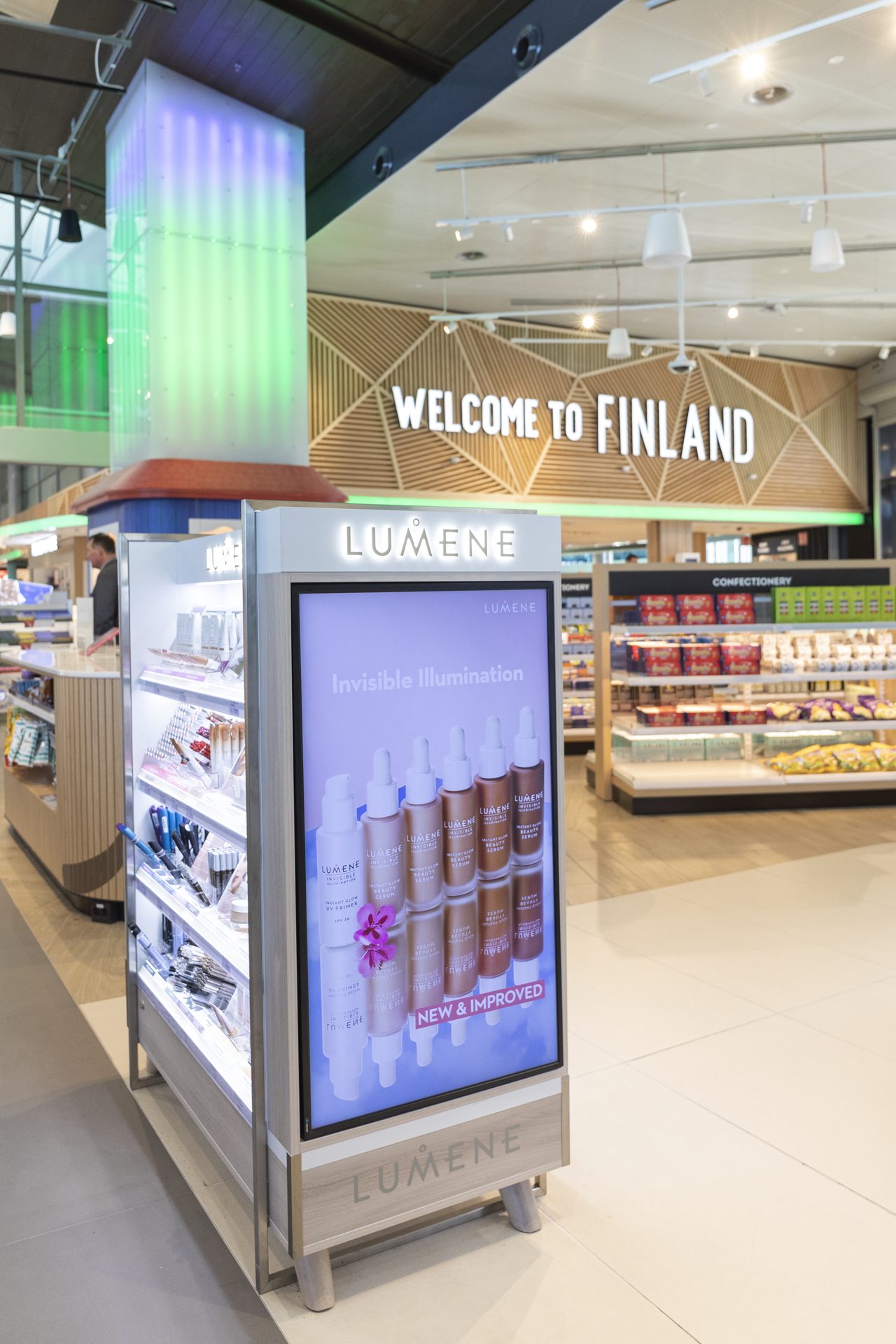 Freestanding Lumene kiosk digital panel reading Invisible Illumination
