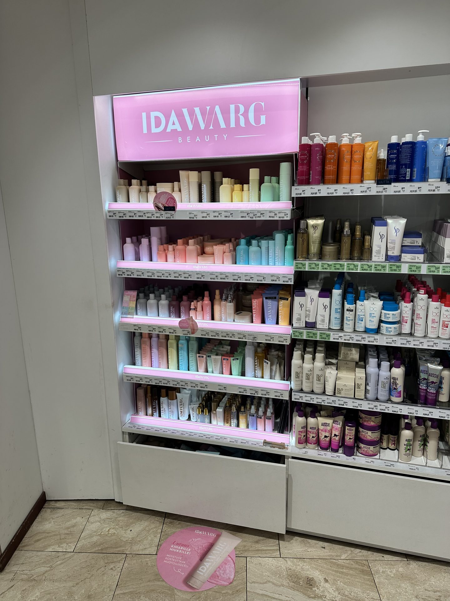 IDAWARG Beauty branded shelf unit with pink backlit strips